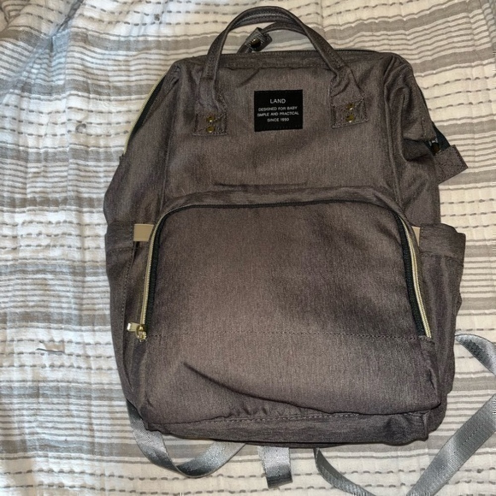 Land Diaper Bag, gray with brass zippers. 

Gently used, in almost new condition